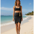 An Elegant Pleated Pencil Skirt Adorned with Golden Floral Decorations, Featuring a High Waist And a Mid-Length Design. This Sophisticated Black Skirt Showcases Eye-Catching Golden Floral Details And a Fitted Silhouette That Beautifully Highlights T